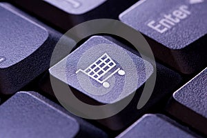 Shopping cart icon on a computer keyboard key photo