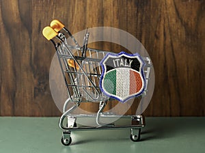 Shopping cart with Italian insignia.