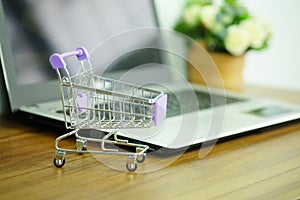 Shopping cart and laptop computer, Concepts online shopping where consumers can buy products directly photo