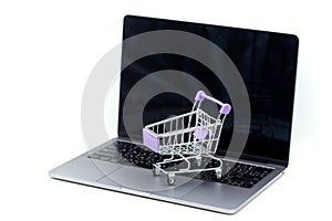 Shopping cart on a laptop,concept about online purchase and shop