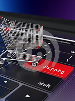 Shopping cart on laptop keyboard for e-commerce