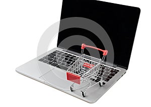 Shopping cart on a laptop keyboard. Ideas about e-commerce, E-commerce or electronic commerce is a transaction of buying or sellin