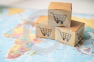 Shopping cart logo on box on world globe map background. Banking Account, Investment Analytic research data economy, trading,