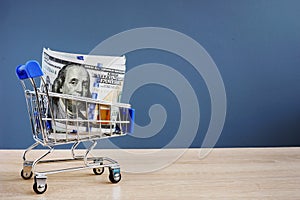 Shopping cart with money. Instant cash loans.