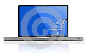 Shopping-cart over a white laptop