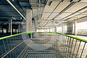 shopping cart in Parking garage interior, industrial building,Empty underground parking background.
