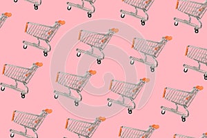 Shopping cart on a pink background. Minimal style. Empty shopping basket. Sale and discounts on goods. Shopping concept