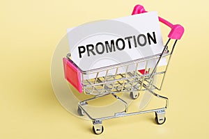 Shopping Cart With Promotion Sign