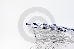 Shopping Cart row on white wall in Retails shop