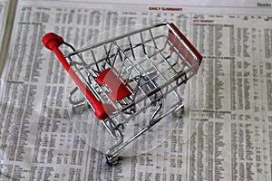 Shopping Cart On The Stock Price Page Of Newspaper