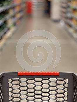 Shopping cart in the supermarket with a blurry background