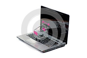 Shopping cart or supermarket trolley with laptop notebook isolated on white background, e-commerce and online shopping concept