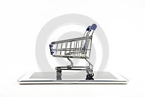 Shopping cart with tablet on white backgrond