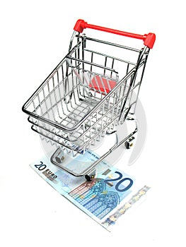 Shopping cart and twenty euro banknote