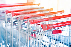 Shopping carts, Shopping cart trolley in row retail department store, Consumer business concept, Selective focus