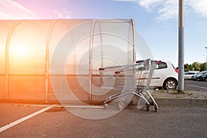 Shopping carts return point on a parking lot near supermarket. R