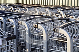 Shopping carts in a row outside a store