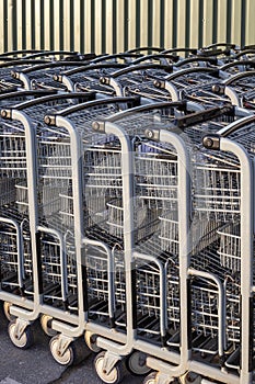 Shopping carts in a row outside a store