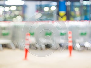 Blurred shopping carts on a parking lot