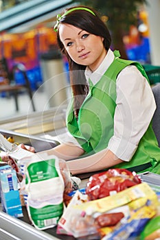 Shopping. Cashdesk worker in supermarket