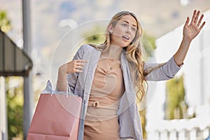 Shopping, city street and hand of woman for taxi in urban travel, wealth and luxury paper bag. Young person or customer