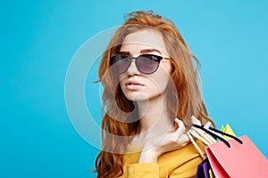 Shopping Concept - Close up Portrait young beautiful attractive redhair girl smiling looking at camera with shopping bag