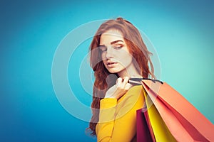 Shopping Concept - Close up Portrait young beautiful attractive redhair girl smiling looking at camera with shopping bag