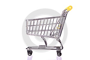 Shopping concept. empty toy shopping trolley isolated on white background