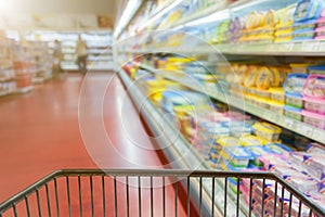 Shopping concept at supermarket in motion blur