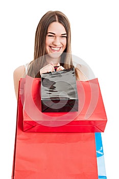 Shopping or consumerism concept with cheerful attractive female