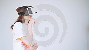 Shopping in cyberspace. Young woman in virtual reality headset chooses gifts on the Internet