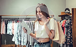 Shopping girl with shopping bags. Beautiful woman in the store