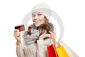 Shopping happy woman holding bags and credit card. Winter sales.