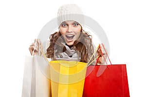 Shopping happy woman holding bags. Winter sales.