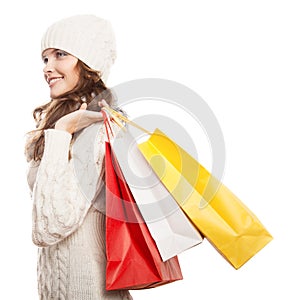 Shopping happy woman holding bags. Winter sales.