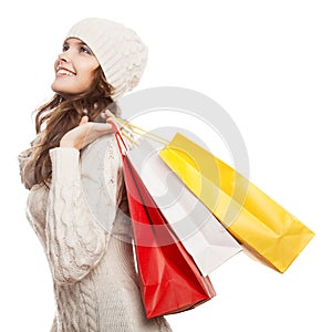 Shopping happy woman holding bags. Winter sales.