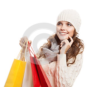 Shopping happy woman holding bags. Winter sales.