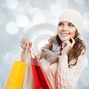 Shopping happy woman holding bags. Winter sales.