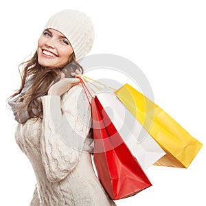 Shopping happy woman holding bags. Winter sales.