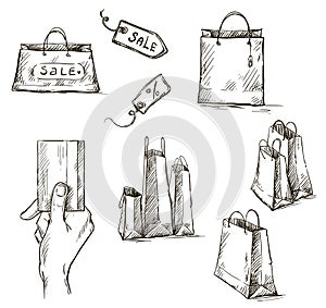 Shopping icons, sale tag, paper bags, hand with cr