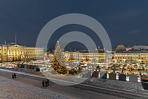 Shopping at the illuminated Christmas Market in the Helsinki Senate Square