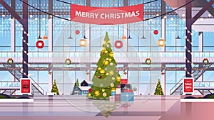 Shopping mall center with decorated fir tree for christmas and new year winter holidays celebration concept