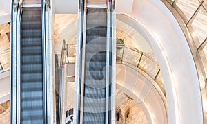 Shopping mall, people in escalator, motion blur