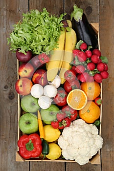 Shopping at market fruits and vegetables in box from above