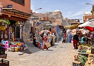 Shopping in the Marrakesh Souk along one side of Jemaa el-Fnaa square and market place in Marrakesh`s medina quarter.