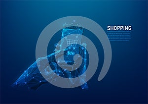 shopping online and digital low poly wireframe. e-commerce concept. hand holding mobile buy online. isolated on blue dark