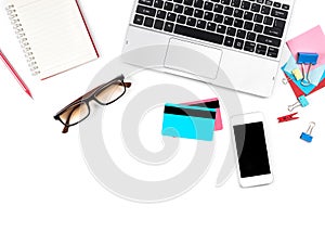 Shopping Online on Modern white desk and table office with laptop and glasses, credit card and other supplies, Top view with