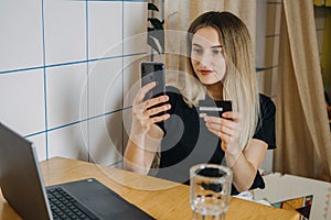 Shopping online, Savvy Shoppers, Installment Payments. Woman at home using credit card and laptop for online payment