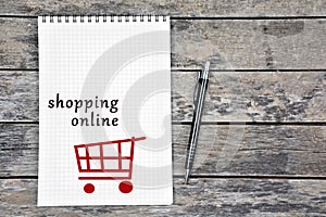 Shopping online words on notebook page