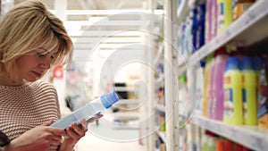 Shopping People Chooses Chemical Cleaning Supplies in Supermarket Close-up 4k